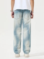 Men's Distressed Relaxed Fit Jeans in Light, model styling view