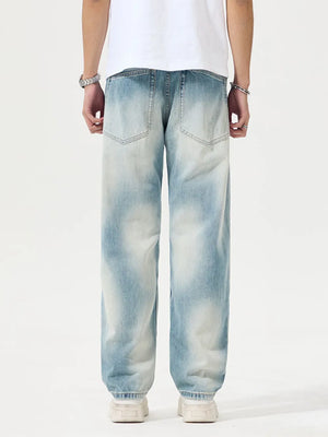 Men's Distressed Relaxed Fit Jeans in Light, model styling view