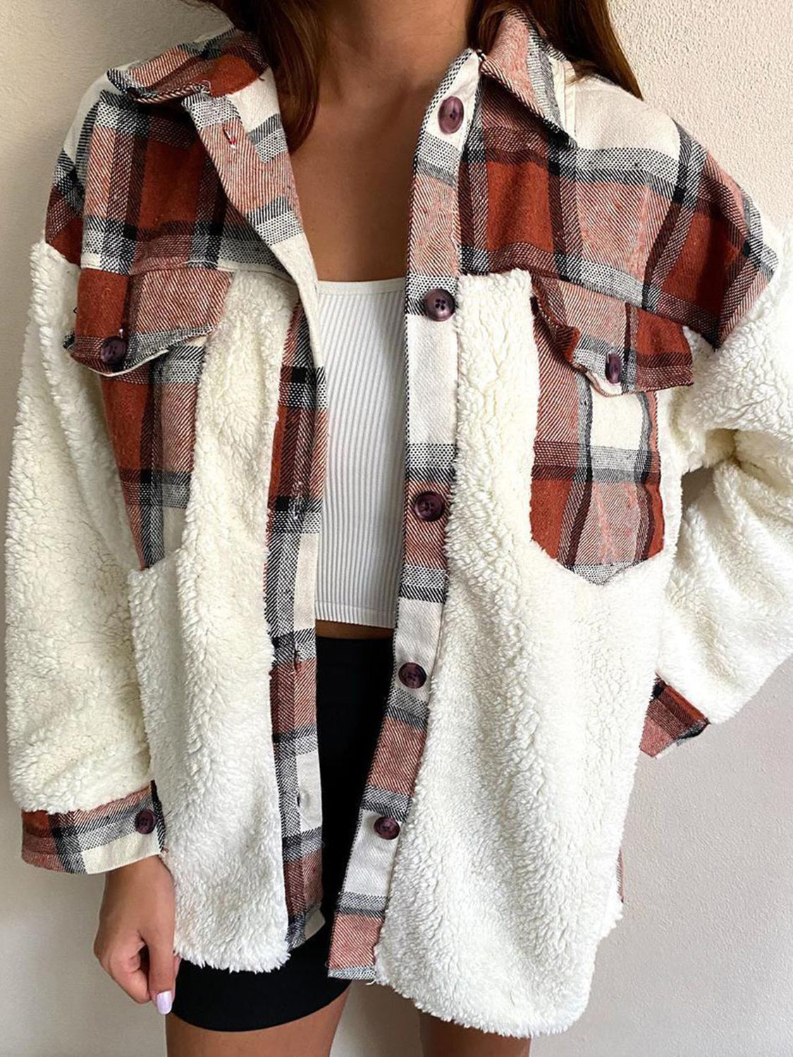 Plaid & Sherpa Hybrid Shacket in Brown with button details and chest pockets.