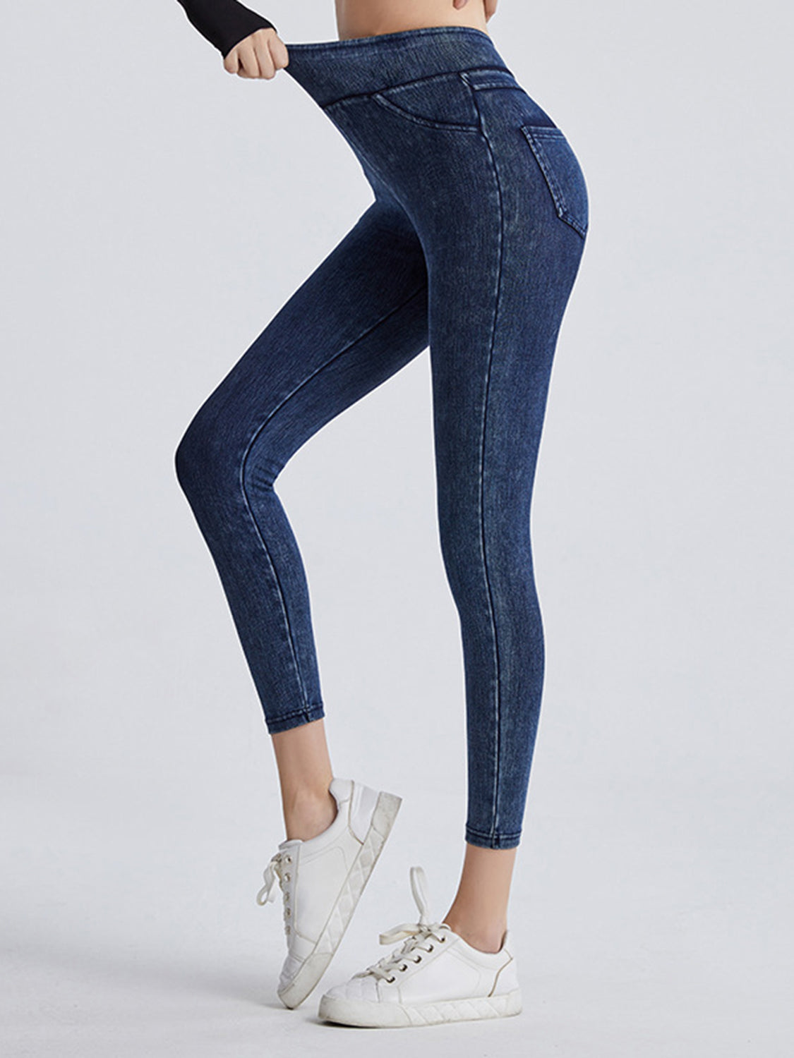 Denim illusion leggings in dark wash with faux pockets and a high waist.
