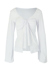 White long sleeve tie-front blouse with a deep V-neckline