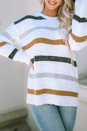 Textured stripe slouchy knit sweater in white with brown, grey, and green stripes.