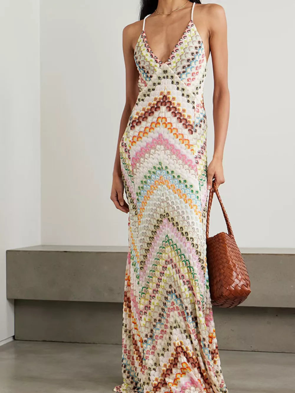 Chevron knit maxi dress with crisscross straps and a colorful geometric pattern.
