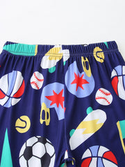 Navy blue baby shorts with sporty print of basketballs, baseballs, skateboards, and soccer balls.