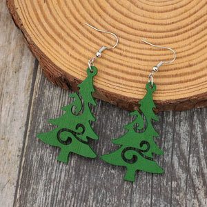 Green Christmas tree earrings with carved scroll details and silver hooks