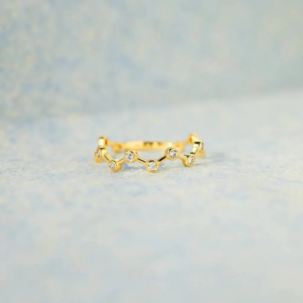 Gold celestial wave ring with small clear stones