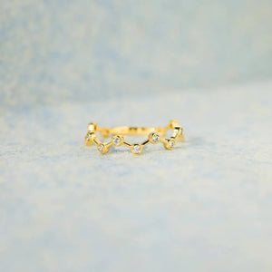 Gold celestial wave ring with small clear stones