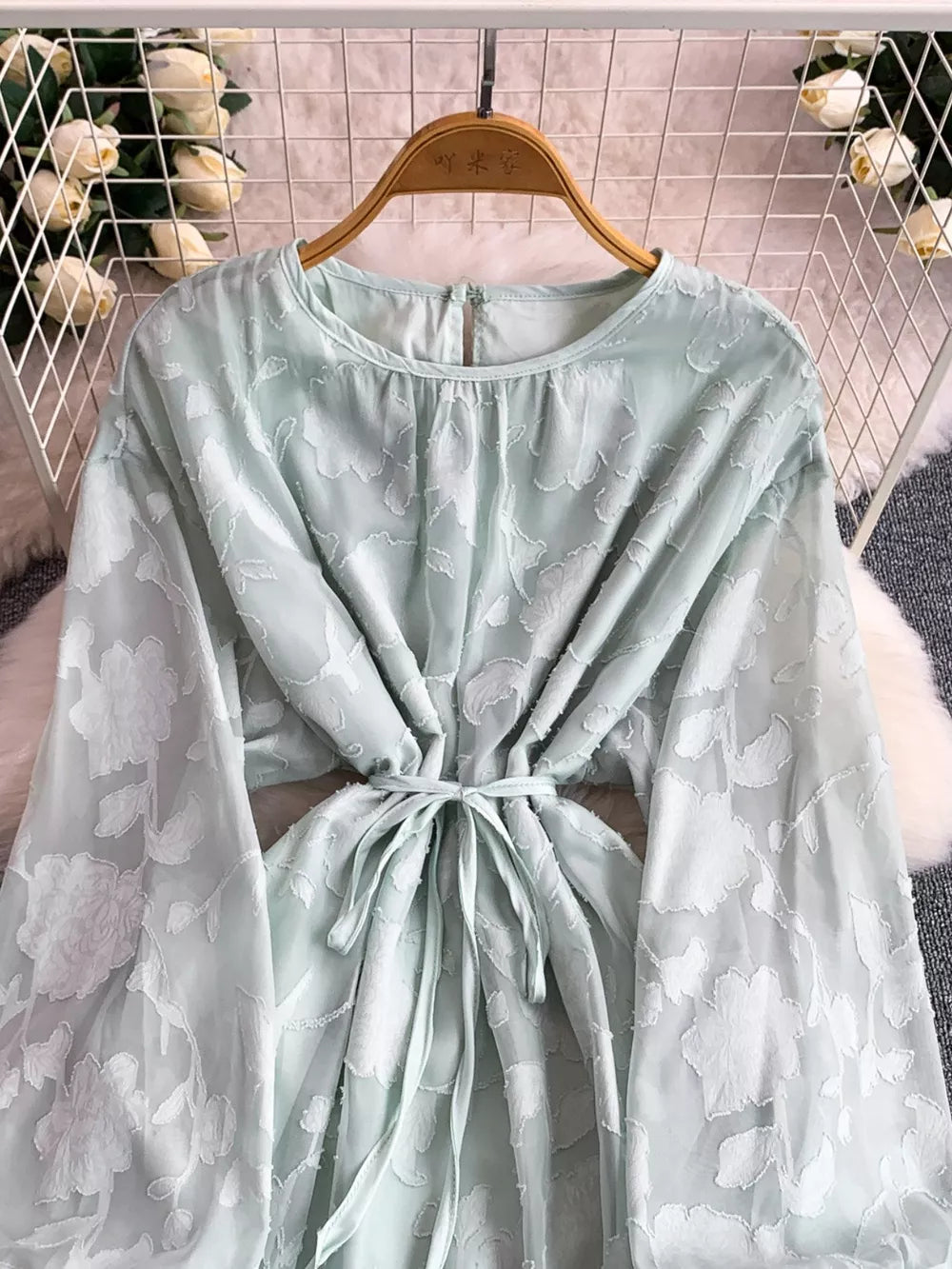 Light Green embroidered tie-waist dress with sheer floral sleeves and a round neckline.