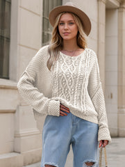 Cable knit cocoon sweater in white with a relaxed fit and crew neck.