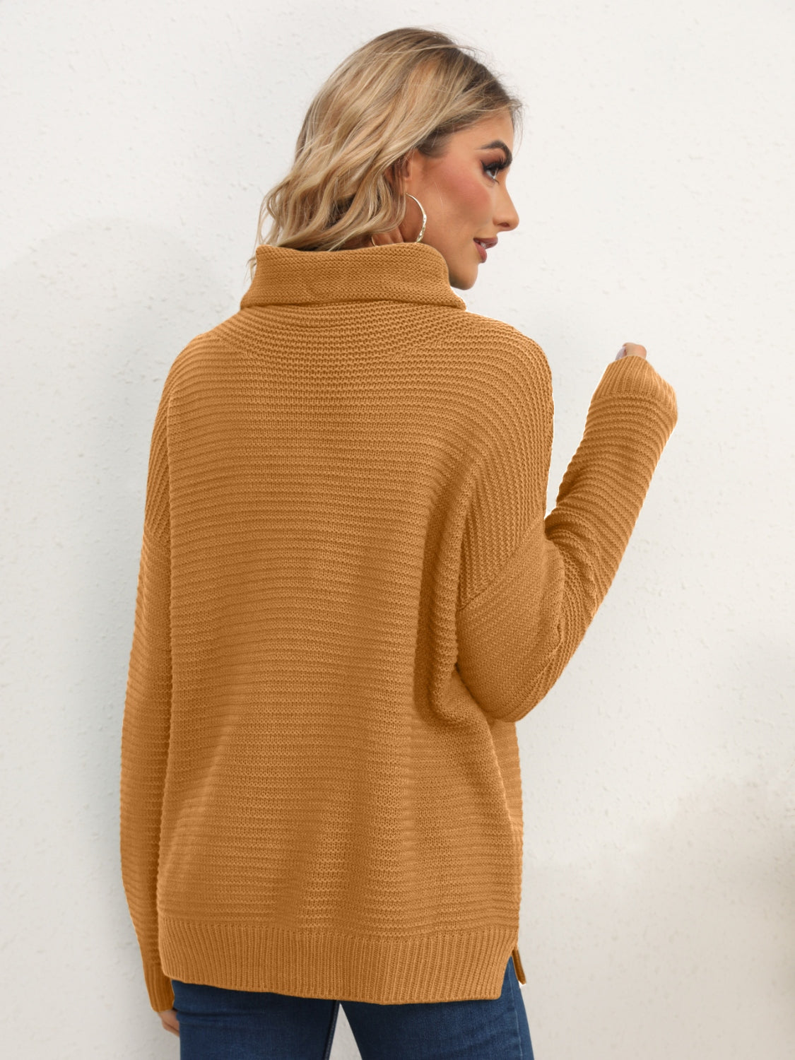 Textured knit oversized turtleneck pullover sweater in mustard acrylic with ribbed details.