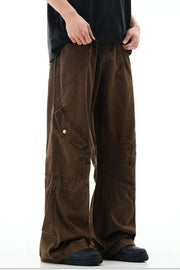Brown cargo pants with snap pockets and detailed stitching.