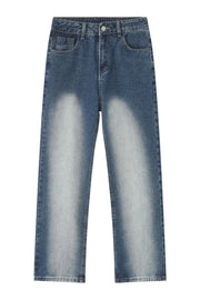 Faded wash baggy jeans in medium blue denim with a relaxed fit and light distressing.
