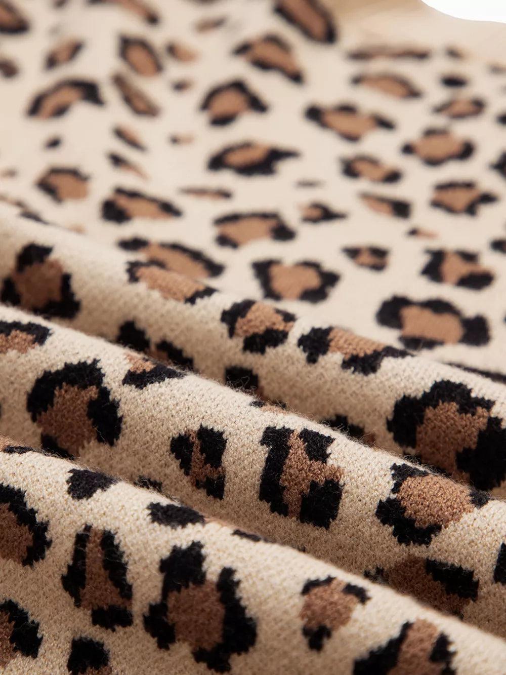 Savanna Spot Long Sleeve Knit Top in beige with an allover leopard print and crew neck.