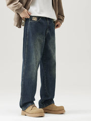 Relaxed fit vintage blue wash denim jeans with a faded look.