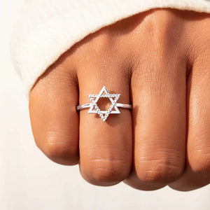 Star of David ring with white zirconia stones on a silver band.