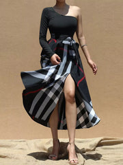 Black one-sleeve asymmetrical midi dress with plaid skirt and waist tie