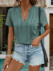 Green V-neck tee with pleated front and lace short sleeves.