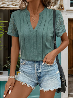Green V-neck tee with pleated front and lace short sleeves.
