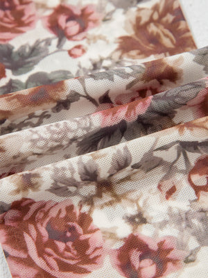 Charming floral mesh blouse with muted pink and brown roses, showing fabric texture.