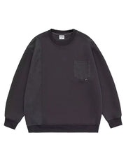 Dark gray sweatshirt with crewneck, pocket, and textured sleeve panel.