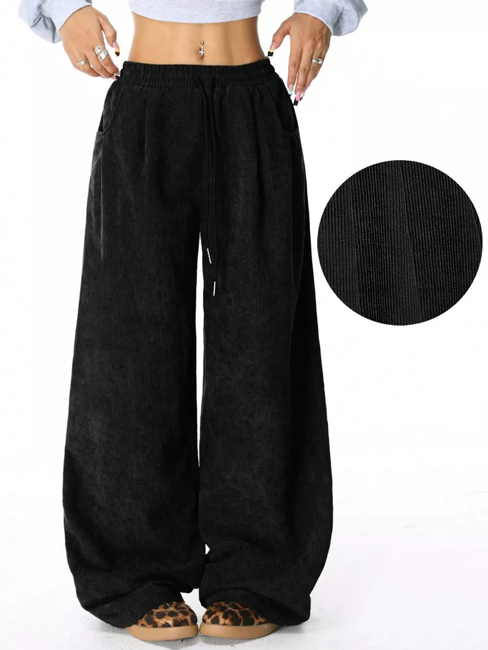 Black corduroy wide-leg maternity cargo pants with drawstring waist and pockets.