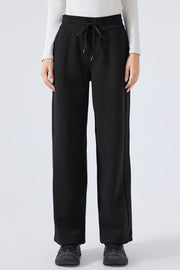 Black relaxed palazzo sweatpants with drawstring waist and pockets
