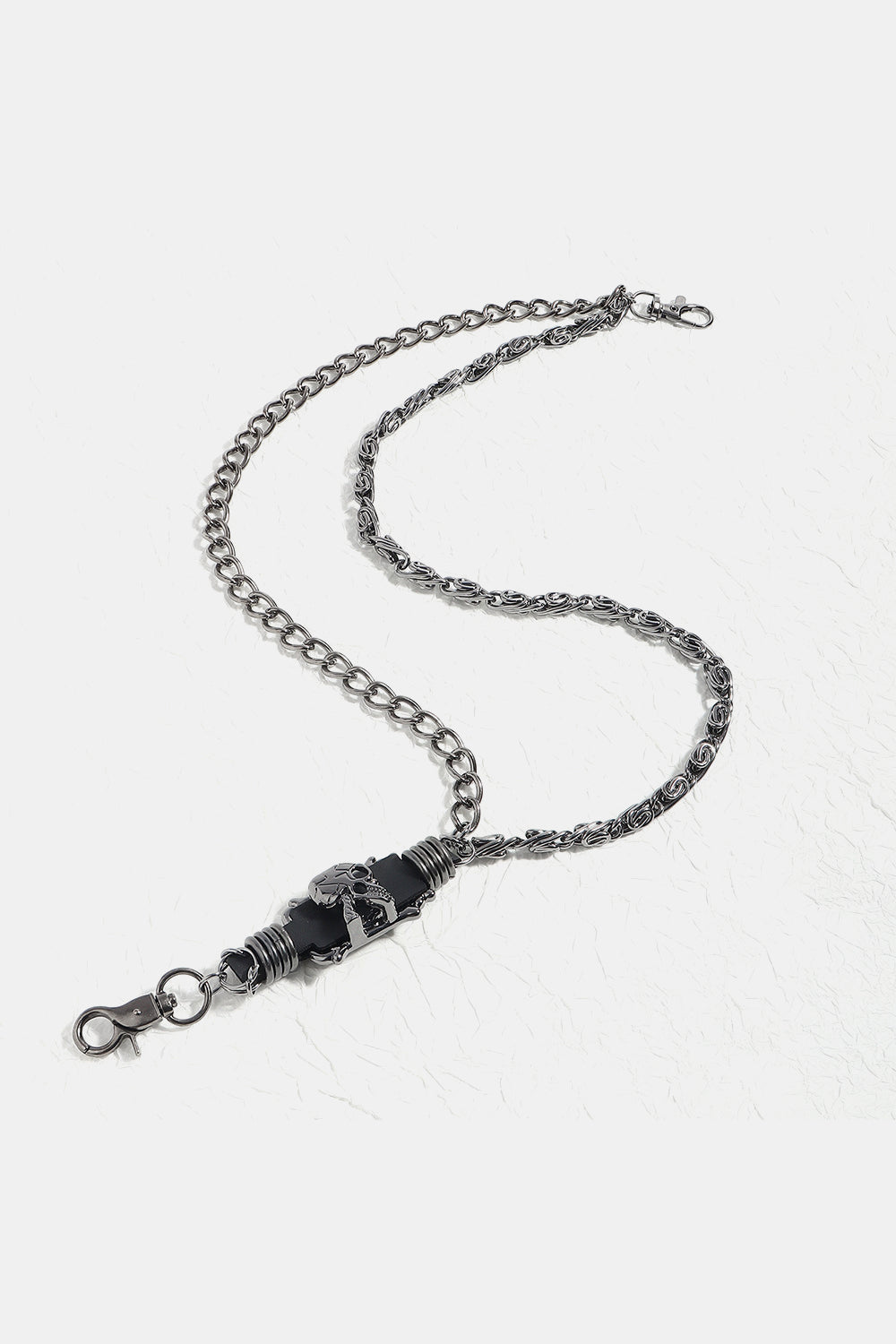 Gothic chain belt in black alloy with skull detail and lobster clasp.