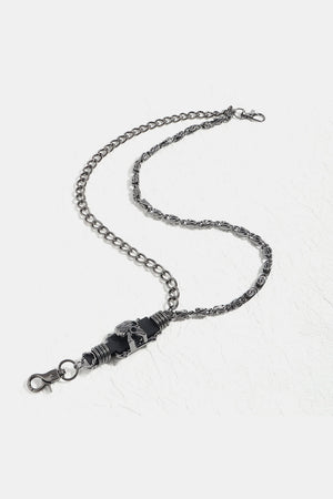Gothic chain belt in black alloy with skull detail and lobster clasp.