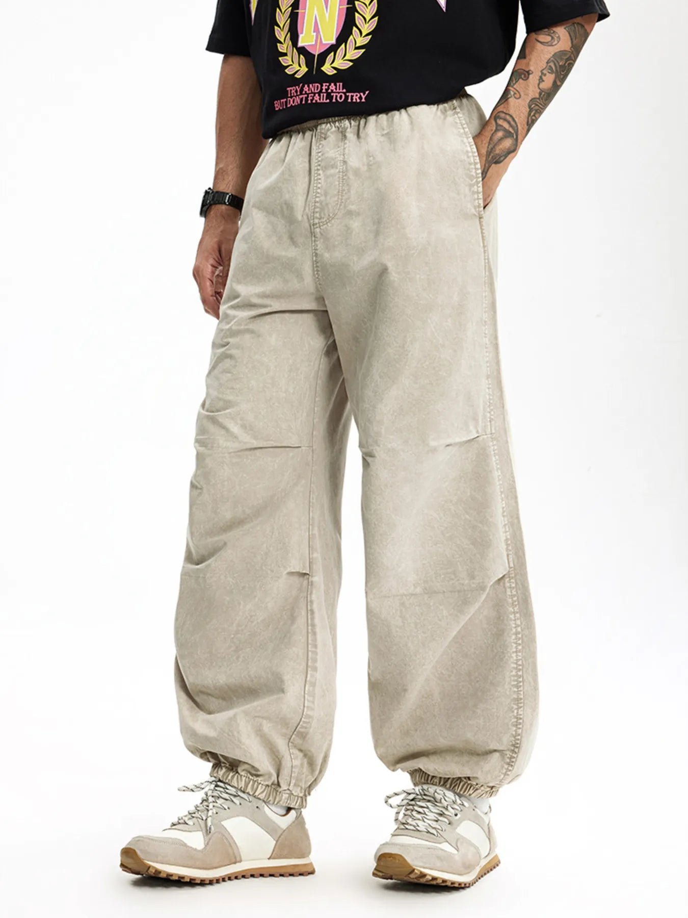 Khaki relaxed fit cargo pants with elastic waistband and cuffs, quick-dry cotton.