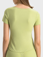 Ribbed notch-neck active t-shirt in Yellow Green with short sleeves.