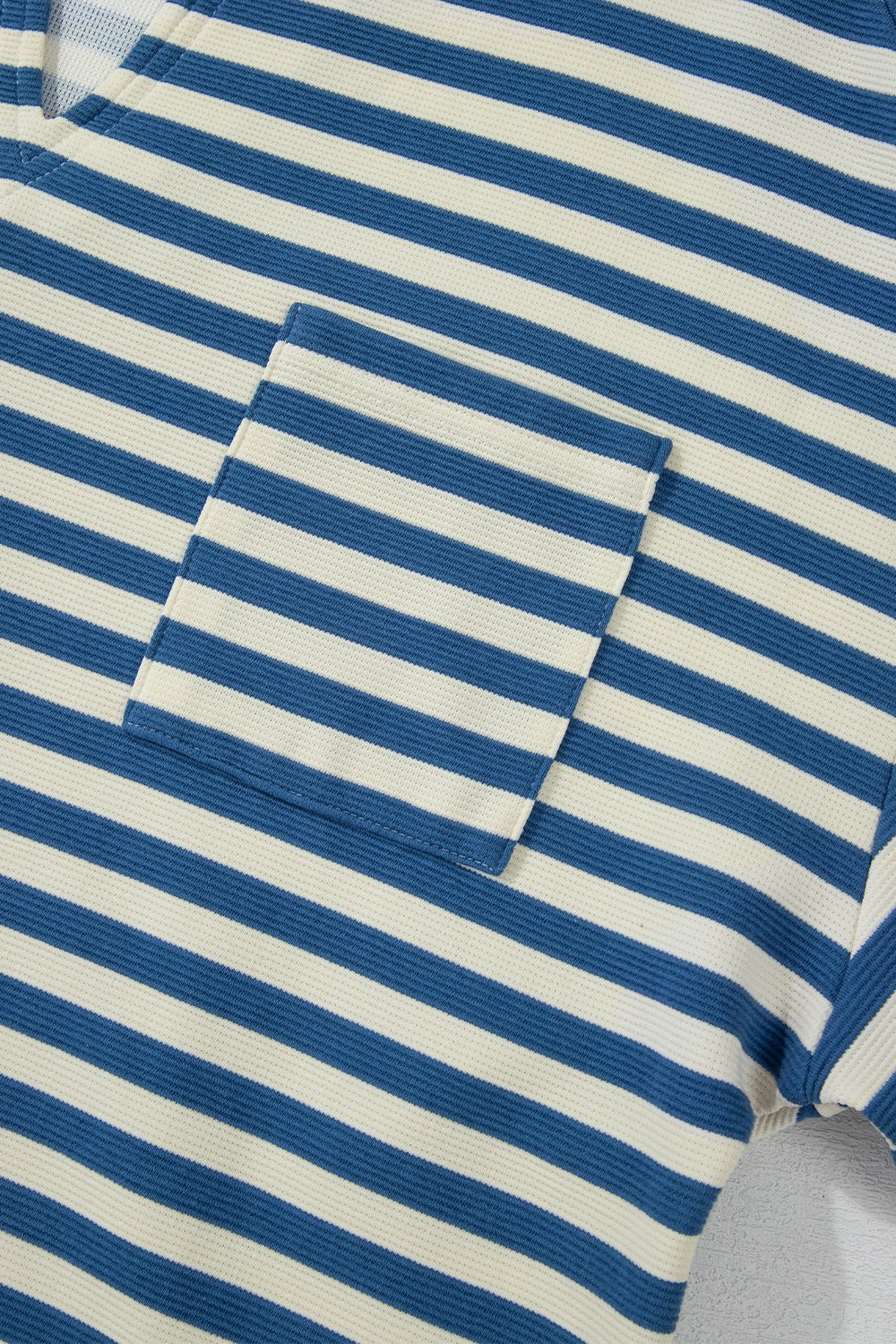 Textured stripe henley pocket top in peacock blue with a waffle knit texture.