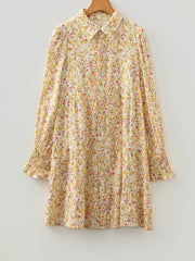 Floral print button-down shirt dress with tiered skirt and smocked cuffs.
