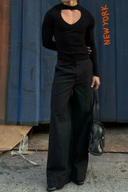 Black ribbed knit long sleeve top with heart cutout neckline