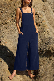 Dark Blue corduroy overalls with wide legs and buttoned straps, featuring side pockets.