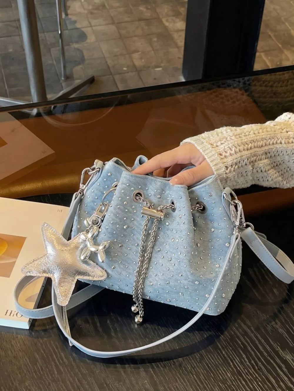 Drawstring Bucket Crossbody Bag in Blue, side view