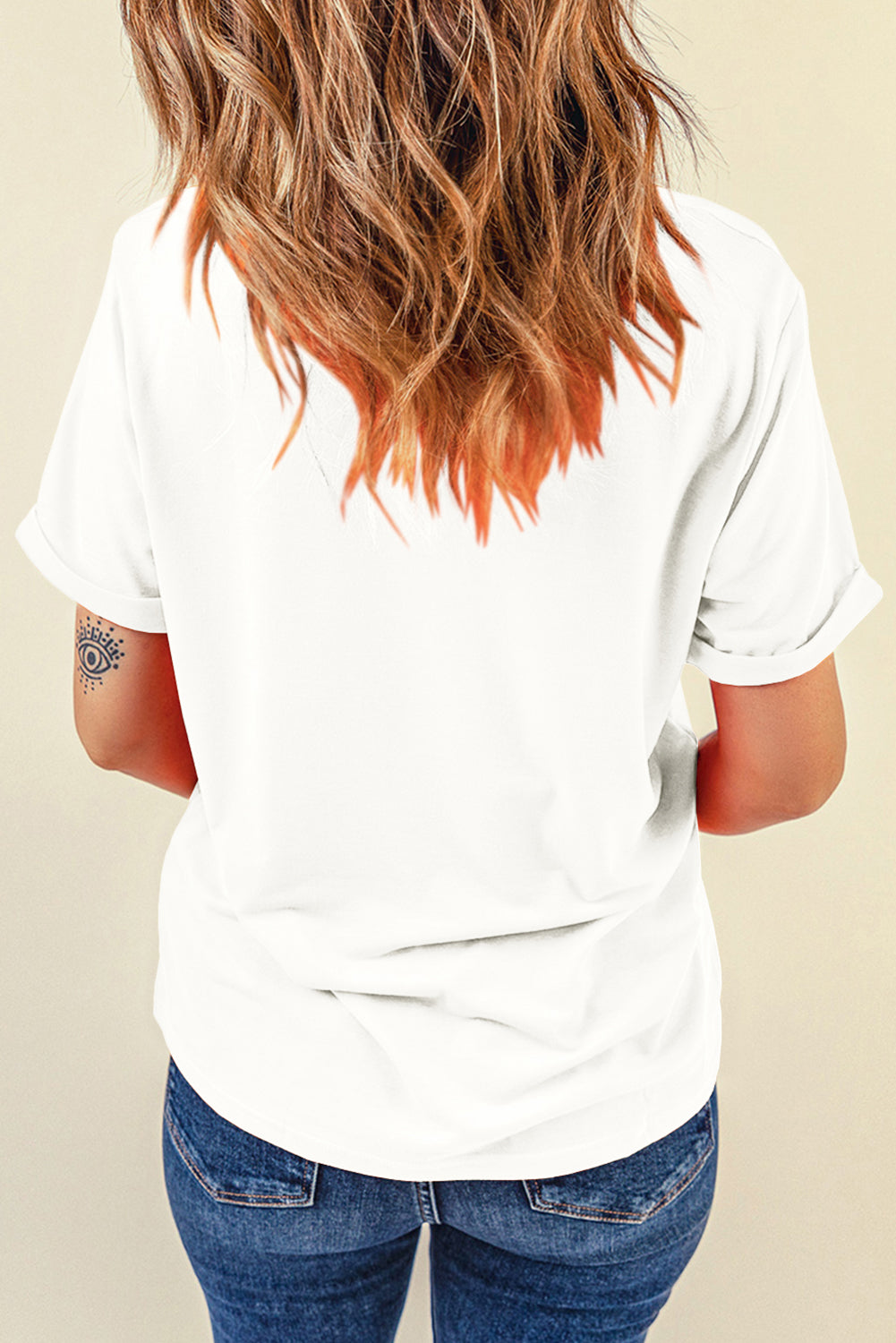 White graphic maternity t-shirt with cuffed short sleeves and a relaxed fit.