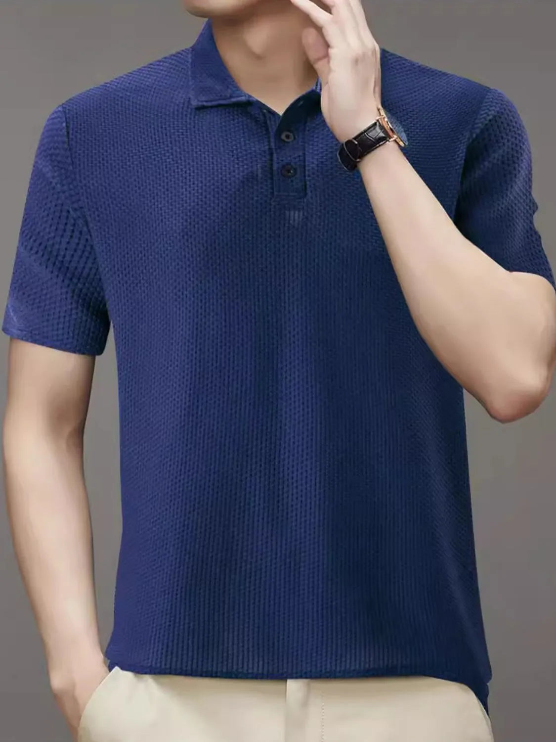 Navy textured knit polo shirt with short sleeves and a two-button placket.