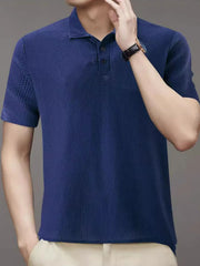 Navy textured knit polo shirt with short sleeves and a two-button placket.