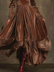 Dark brown velvet maxi dress with voluminous sleeves and ruffled hem
