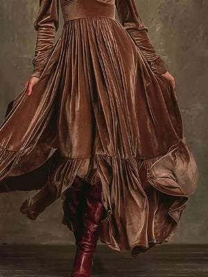 Dark brown velvet maxi dress with voluminous sleeves and ruffled hem