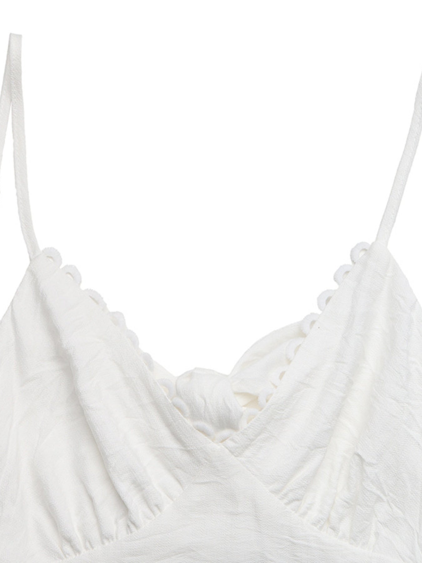 White lace tiered maxi dress with scalloped trim and a knot detail.