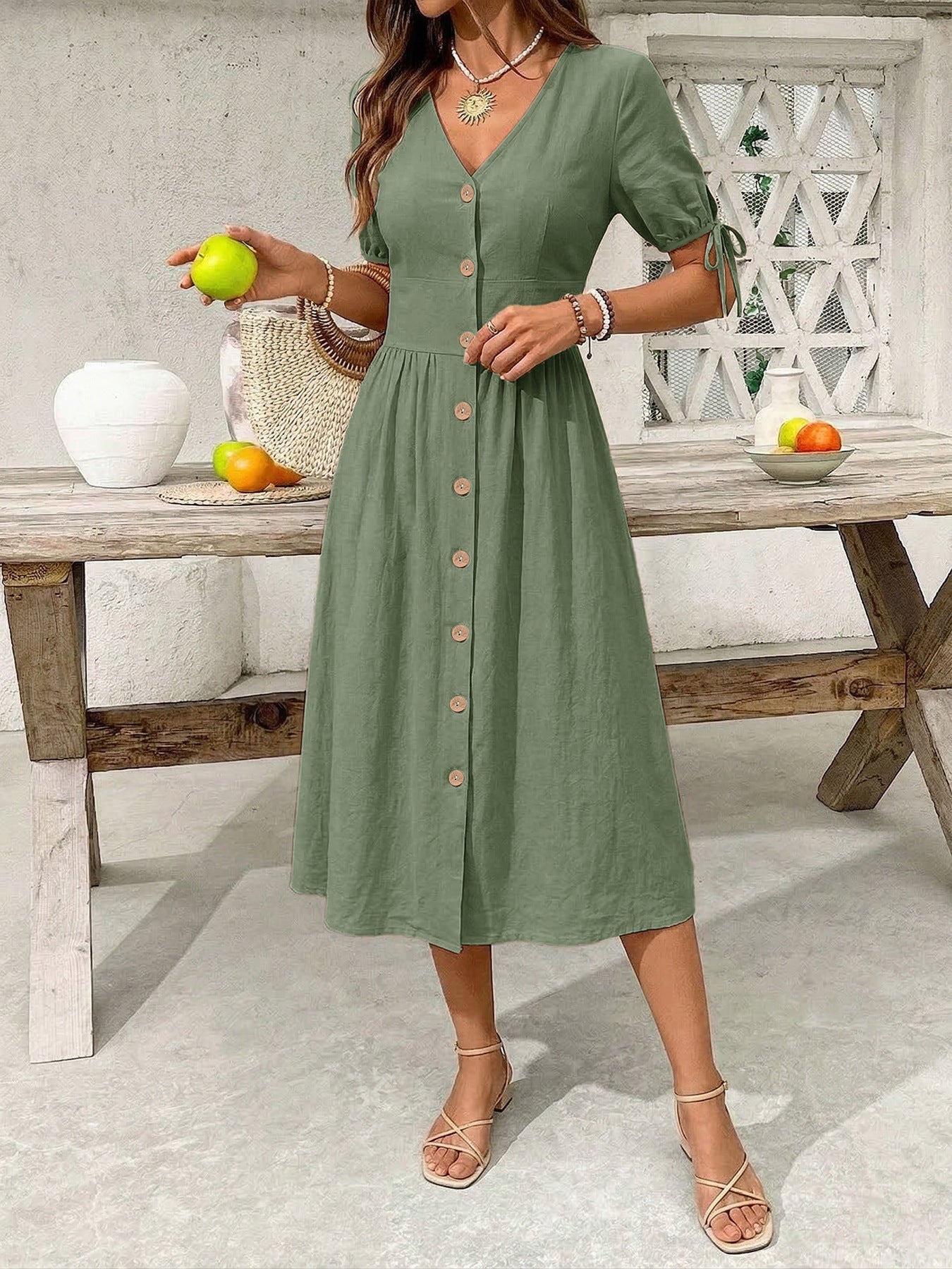 Sage button-down midi dress with tie sleeves and wooden buttons