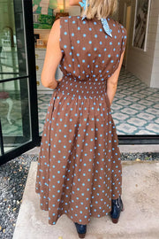 Brown polka dot midi dress with smocked waist and blue neck scarf