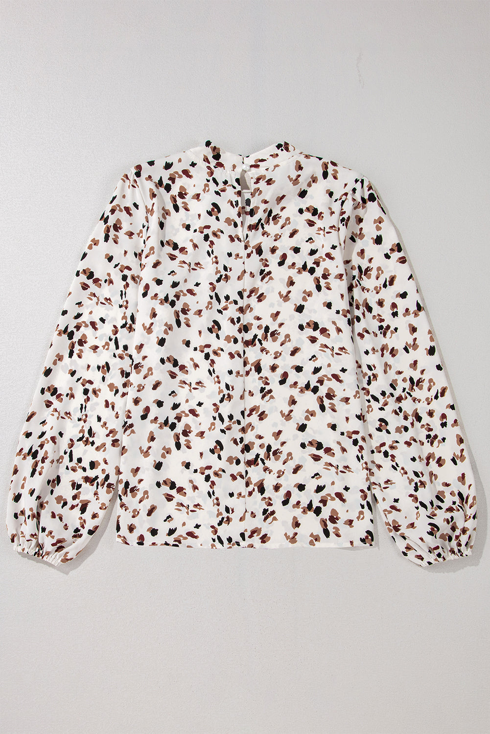 White abstract print blouse with high neck and balloon sleeves