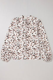 White abstract print blouse with high neck and balloon sleeves