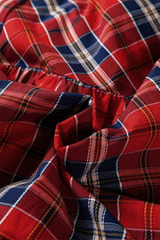 Charming tartan mini dress in red, navy, and cream plaid cotton blend with frilly collar detail.