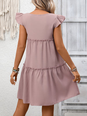 Light Purple ruffled cap sleeve mini dress with tiered skirt and frill details.