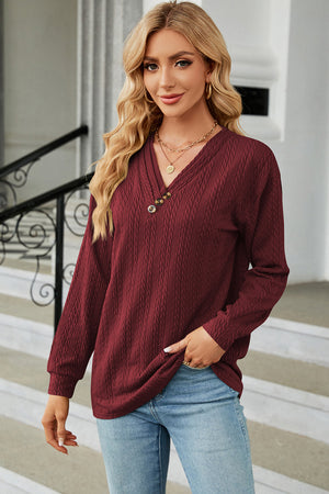 Burgundy textured cable-knit henley pullover with V-neck and button detail