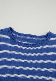 Blue striped knit sweater with a crew neck and textured fabric.