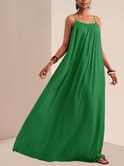 Green maxi swim dress with spaghetti straps and gathered neckline.
